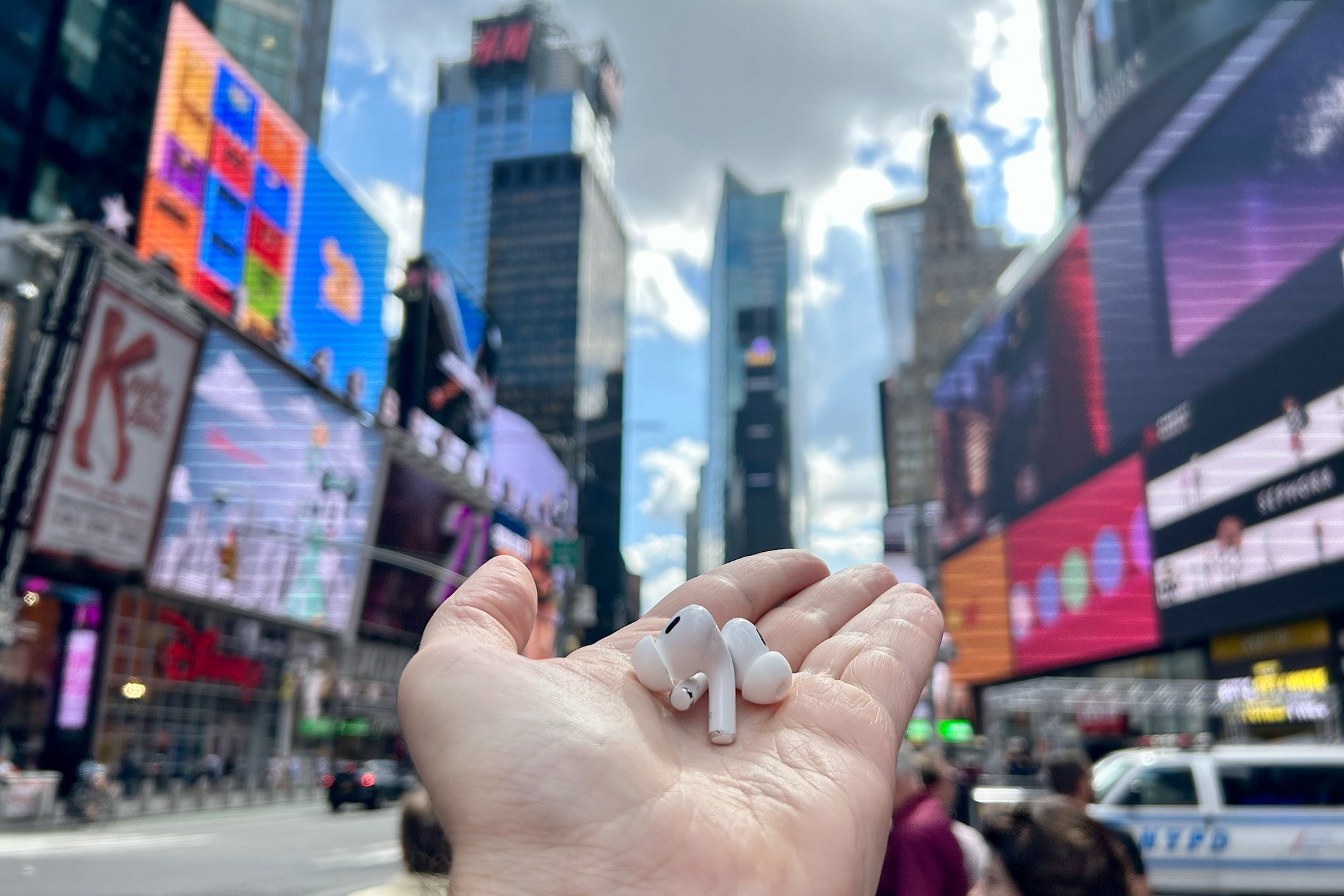 AirPods Pro 2 in my hand in Times Square