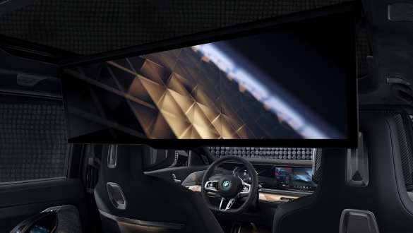Luxury rear BMW M760e xDrive Sedan G70 Interior rear with BMW Theatre Screen BMW M760e xDrive Sedan G70