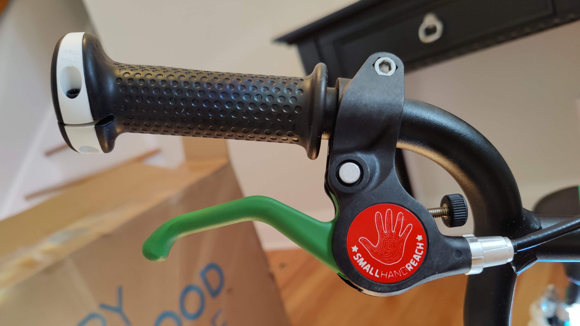 The Woom bike brake lever and grip close-up